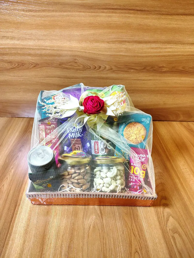 Festive hamper basket with dry fruits and snacks