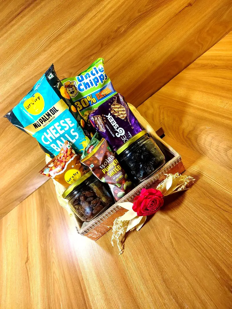 Diwali hamper tray with cheese balls, chocolates and dry fruit jars