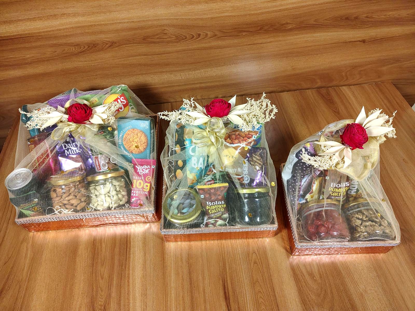 Festive gift boxes in three sizes, wrapped and ready to go