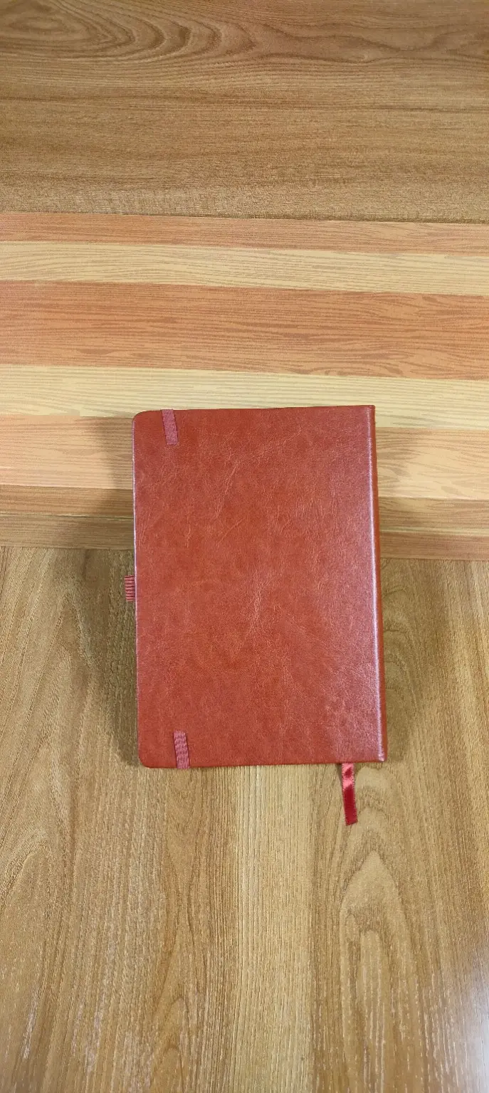 Notebook 13 — Tan Corner-Strap Notebook